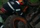 Pompieri chemați pentru a scoate un bărbat de sub un tractor răsturnat
